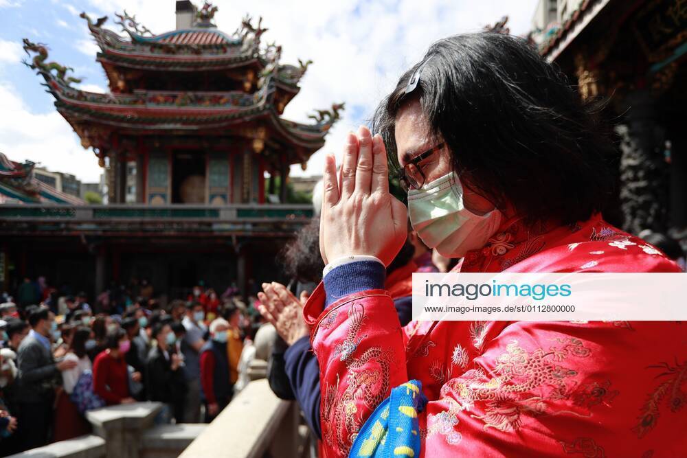A Taiwanese wearing a mask pays worships at Lungshan Temple that was build during the World War II, as the Year of the Ox has come alongside the Lunar New Year Festival, amidst the Covid-19 pandemic. The islandÃ¢â‚¬â ¢s authority has put large gatherings, activities for festival celebration in cancellation or suspension due to a domestic outbreak. Taipei Taiwan - ZUMAs313 20210212_zip_s313_003