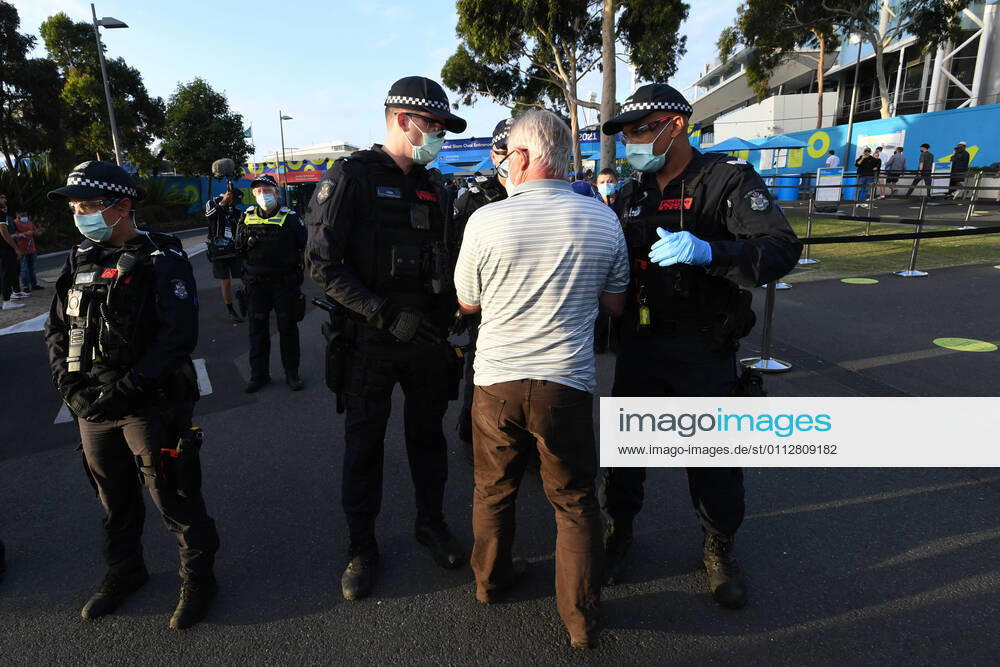 ANTI LOCKDOWN PROTEST MELBOURNE, A man tries to enter the Australian Open during an anti-lockdown protest in Melbourne, Friday, February 12, 2021. Victoria will enter a five-day lockdown from 11.59pm on Friday in an effort to contain an outbreak linked to a quarantine hotel. ( NO ARCHIVING, , NO USE IN BOOKS WITHOUT CONSENT MELBOURNE VIC AUSTRALIA