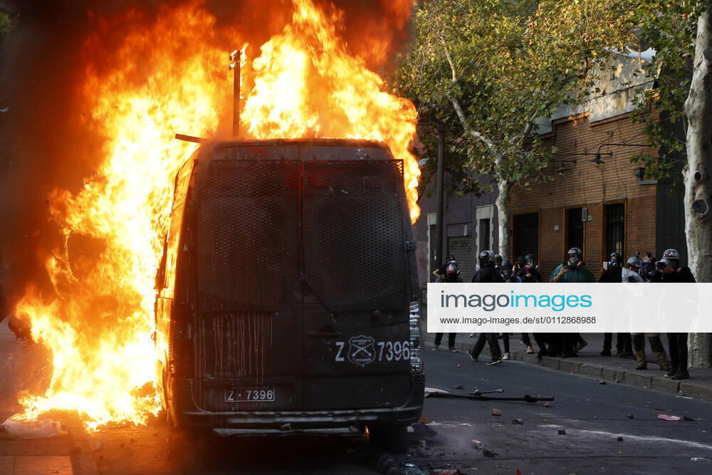 Carabineros van is set on fire during the protest by prisoners of the social outbreak in the center of the capital during the coronavirus pandemic Dragomir Yankovic Aton Chile, Santiago Chile Aton 488472