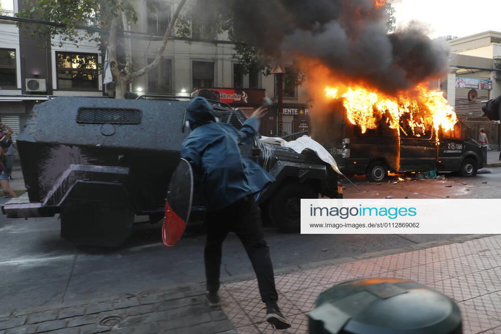 Carabineros van is set on fire during the protest by prisoners of the social outbreak in the center of the capital during the coronavirus pandemic Dragomir Yankovic Aton Chile, Santiago Chile Aton 488474