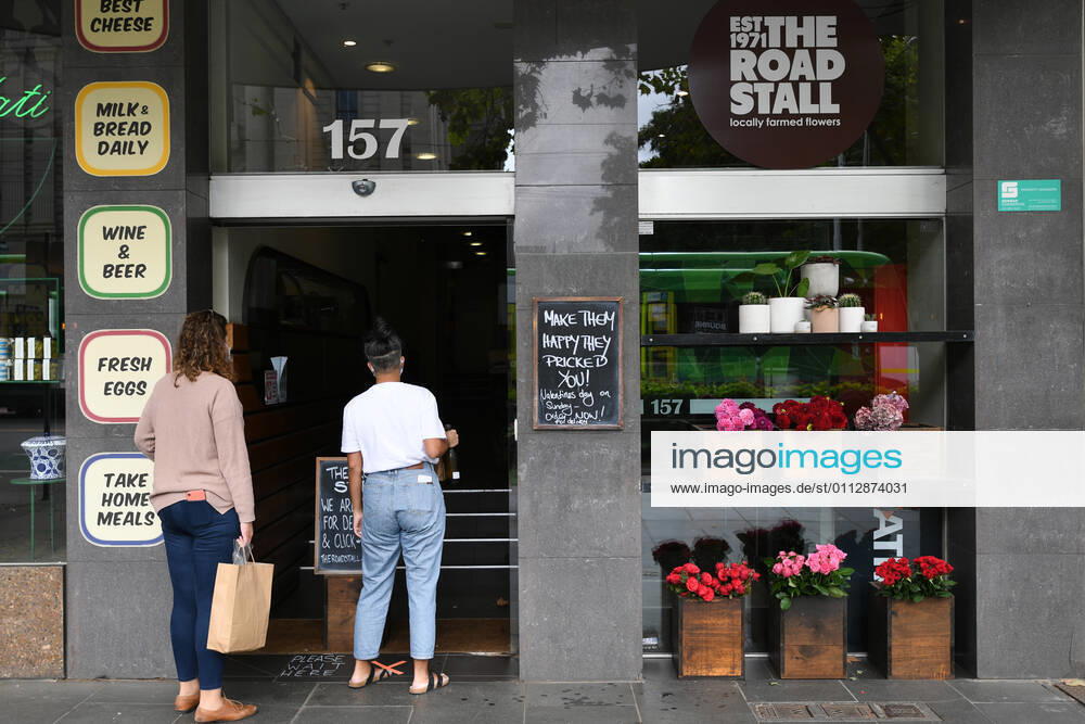 VICTORIA CORONAVIRUS COVID19, Customers order flowers from outside the ?Flowers by The Road Stall? florist in Melbourne, Saturday, February 13, 2021. Victoria has entered a short, sharp circuit-breaker lockdown for five days amid fears the highly infectious UK strain of coronavirus has spread in the community. ( NO ARCHIVING, , NO USE IN BOOKS WITHOUT CONSENT MELBOURNE VIC AUSTRALIA