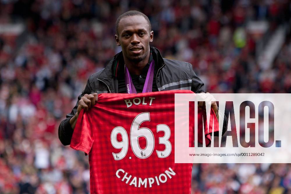 Football - Premier League; Manchester United (ManU) - Fulham FC; Jamaican sprinter Usain Bolt poses for photographs with his medals at Old Trafford