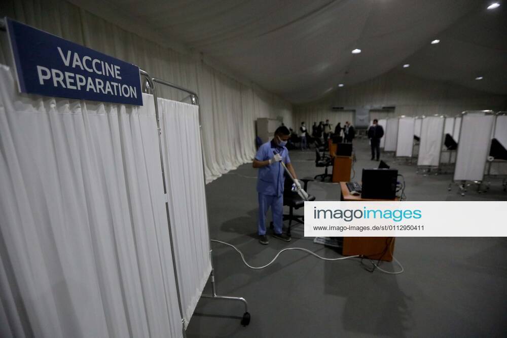 (210213) -- BEIRUT, Feb. 13, 2021 -- People make preparations at a COVID-19 vaccination center at a hospital in Beirut, Lebanon, on Feb. 13, 2021. Lebanon received on Saturday the first batch of Pfizer-BioNTech vaccines with the vaccination campaign set to begin on Sunday. ) LEBANON-BEIRUT-COVID-19 VACCINES-PREPARATIONS BilalxJawich