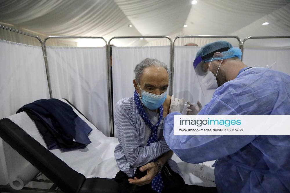(210214) -- BEIRUT, Feb. 14, 2021 -- An elderly staff member of the Saint George Hospital receives a dose of vaccine against COVID-19 in Beirut, Lebanon, on Feb. 14, 2021. Lebanon launched on Sunday its vaccination campaign by starting with employees in the health sector after receiving, a day earlier, 28,500 vaccines from Pfizer-BioNTech, LBCI local TV channel reported. ) LEBANON-BEIRUT-COVID-19-VACCINATION BilalxJawich