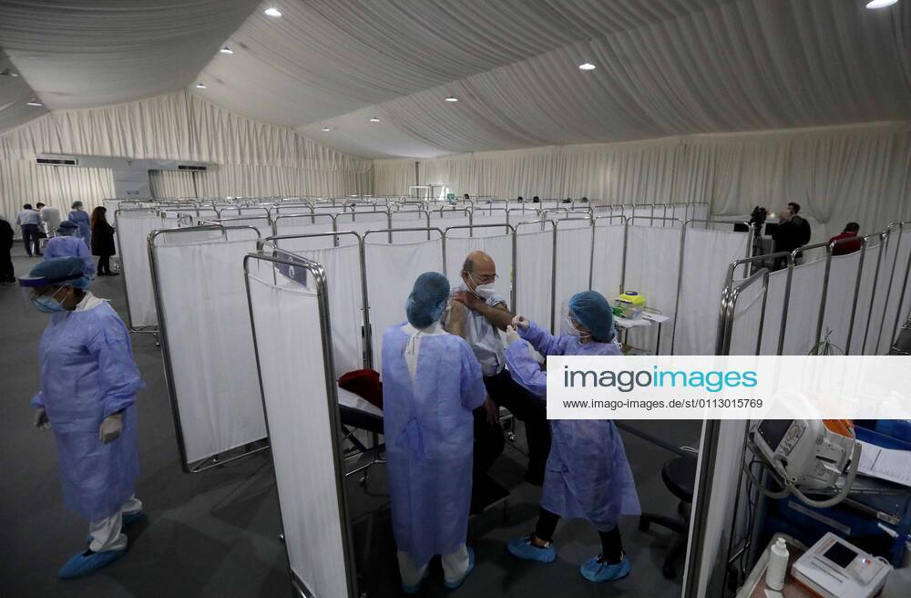 (210214) -- BEIRUT, Feb. 14, 2021 -- An elderly staff member of the Saint George Hospital receives a dose of vaccine against COVID-19 in Beirut, Lebanon, on Feb. 14, 2021. Lebanon launched on Sunday its vaccination campaign by starting with employees in the health sector after receiving, a day earlier, 28,500 vaccines from Pfizer-BioNTech, LBCI local TV channel reported. ) LEBANON-BEIRUT-COVID-19-VACCINATION BilalxJawich