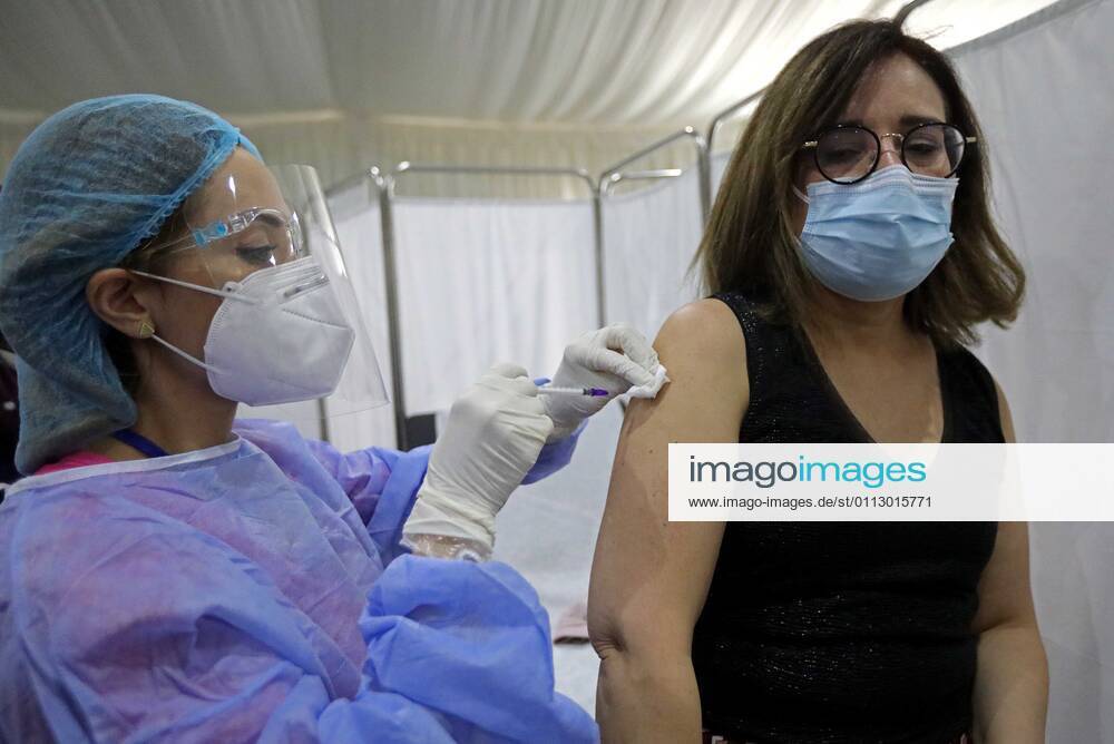 (210214) -- BEIRUT, Feb. 14, 2021 -- A staff member of the Saint George Hospital receives a dose of vaccine against COVID-19 in Beirut, Lebanon, on Feb. 14, 2021. Lebanon launched on Sunday its vaccination campaign by starting with employees in the health sector after receiving, a day earlier, 28,500 vaccines from Pfizer-BioNTech, LBCI local TV channel reported. ) LEBANON-BEIRUT-COVID-19-VACCINATION BilalxJawich
