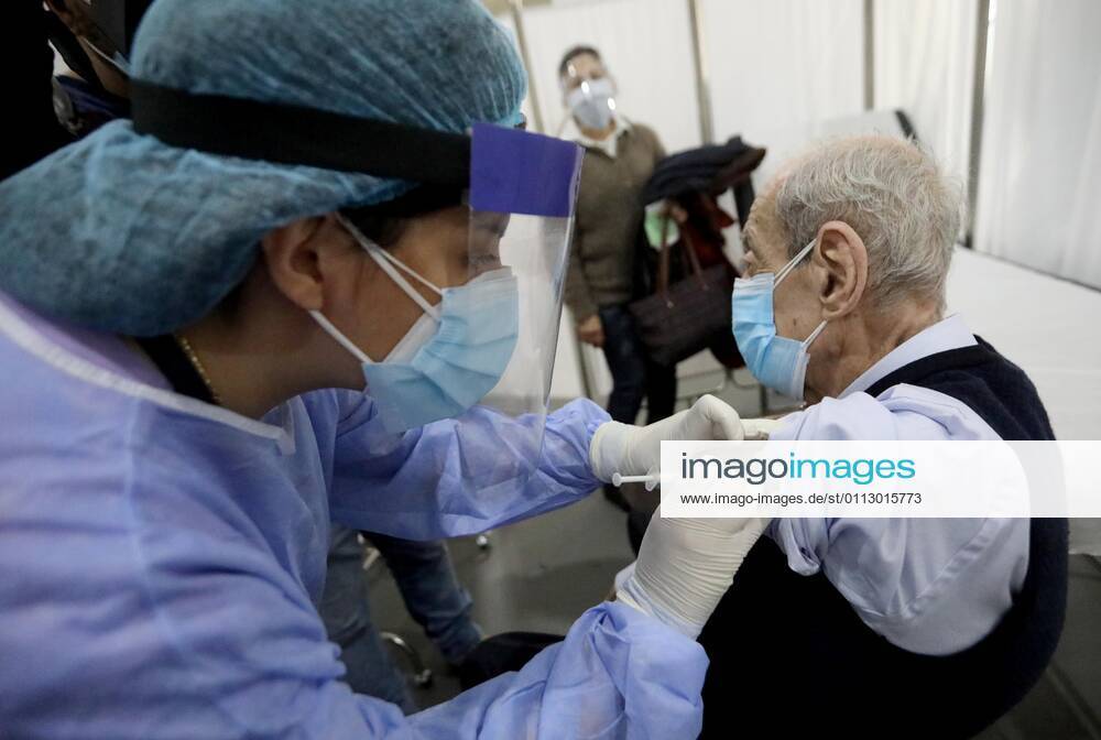 (210214) -- BEIRUT, Feb. 14, 2021 -- An elderly staff member of the Saint George Hospital receives a dose of vaccine against COVID-19 in Beirut, Lebanon, on Feb. 14, 2021. Lebanon launched on Sunday its vaccination campaign by starting with employees in the health sector after receiving, a day earlier, 28,500 vaccines from Pfizer-BioNTech, LBCI local TV channel reported. ) LEBANON-BEIRUT-COVID-19-VACCINATION BilalxJawich