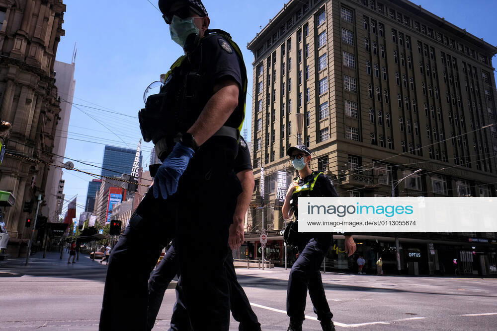 VICTORIA CORONAVIRUS COVID19, Victorian Police officers walk around Melbourne?s CBD , Monday, February 15, 2021. Victorians are in lockdown for the third time amid fears the highly infectious UK strain of coronavirus has spread in the community. ( NO ARCHIVING, , NO USE IN BOOKS WITHOUT CONSENT MELBOURNE VIC AUSTRALIA