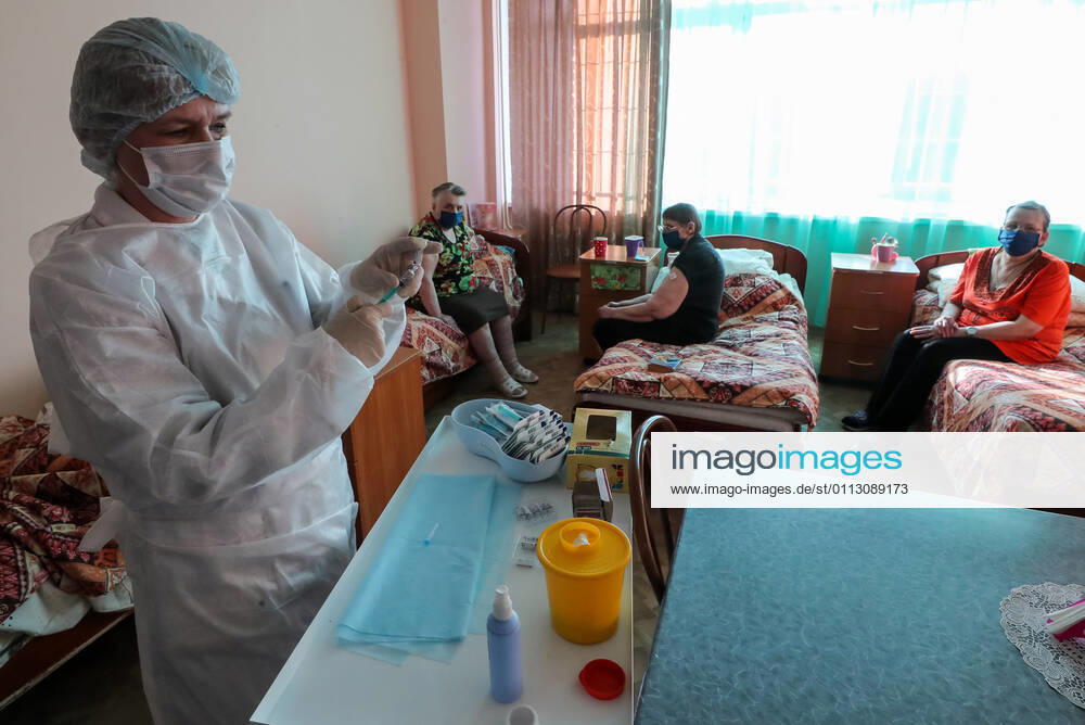 ST PETERSBURG, RUSSIA â€” FEBRUARY 15, 2021: A medical worker fills a syringe with the Gam-COVID-Vac vaccine (under the brand name of Sputnik V) while vaccinating people against COVID-19 at No 7 Neuropsychiatric Care Home. Alexander Demianchuk TASS TS0F6D0C