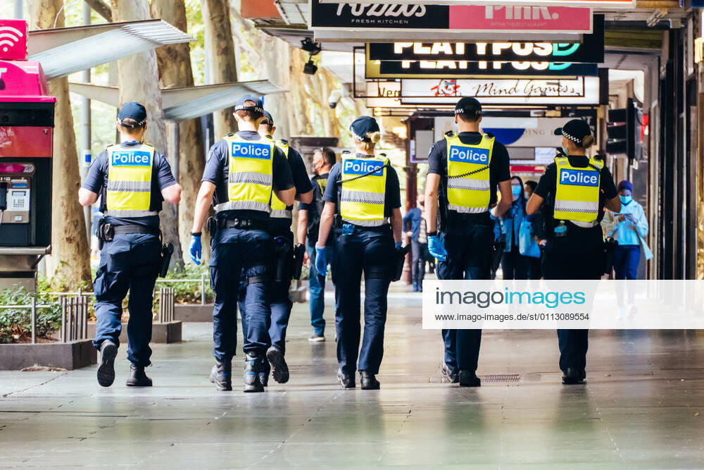 Melbourne, Australia - February 15 2021: Police patrol the streets of Melbourne at the start of a circuit breaker lockdown imposed suddenly by the Victorian Government. This is due to increasing numbers of COVID-19 cases in north western Melbourne. - ZUMAp121 20210215_zsp_p121_015