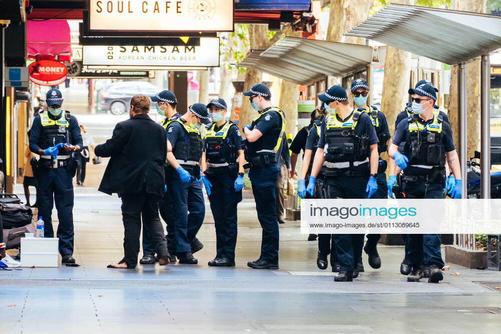 Melbourne, Australia - February 15 2021: Police patrol the streets of Melbourne at the start of a circuit breaker lockdown imposed suddenly by the Victorian Government. This is due to increasing numbers of COVID-19 cases in north western Melbourne. - ZUMAp121 20210215_zsp_p121_016
