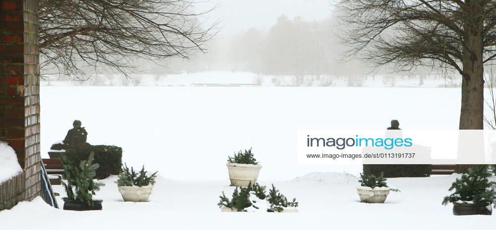 View of the frozen and snow-covered Stadtparksee in the Hamburg Stadtpark Winterhude Hamburg