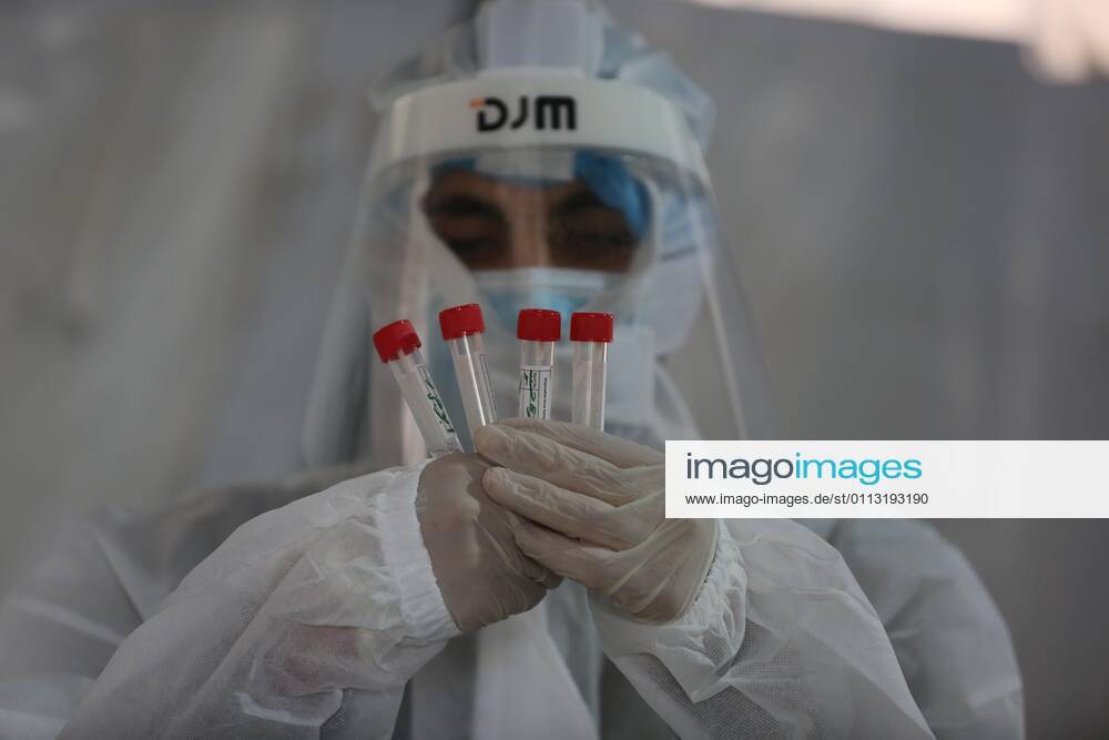 Khan Younis, Gaza Strip, Palestinian Territory: A Palestinian health worker holds swab samples collected to test for Covid-19 in Khan Younis in the southern Gaza Strip, on February 16, 2021. The Palestinian Authority accused Israel of refusing to allow some 2,000 coronavirus vaccine doses destined for Gaza health workers into the blockaded coastal strip Khan Younis Palestinian Territory - ZUMAap3_ 20210216_zaf_ap3_044