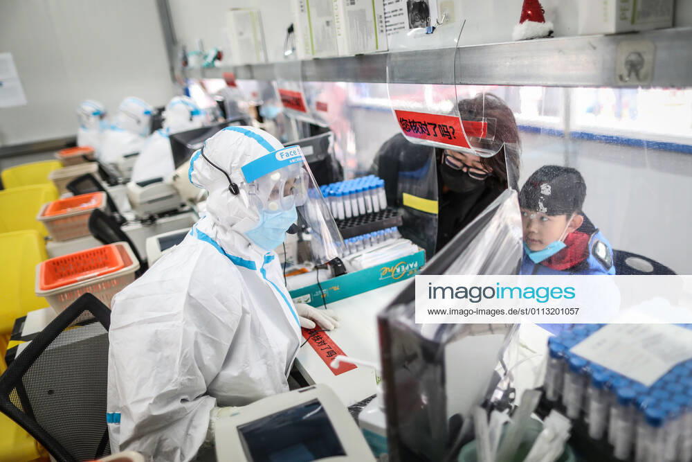 (210216) -- SHENYANG, Feb. 16, 2021 -- Sun Hewen, a medical worker with Shengjing Hospital of China Medical University, collects nucleic acid samples in Shenyang, capital of northeast China s Liaoning Province, Feb. 16, 2021. Since December last year, some areas in China s northeastern Heilongjiang, Jilin, and Liaoning Provinces reported newly confirmed COVID-19 cases. Related areas responded immediately according to epidemic prevention requirements. Mass nucleic acid testing were conducted in key areas in an effort to stem the spread of the coronavirus. Recently, no new confirmed COVID-19 cases have been reported here for several days. During the Spring Festival vacation, many workers stick to their posts to make sure we can celebrate the