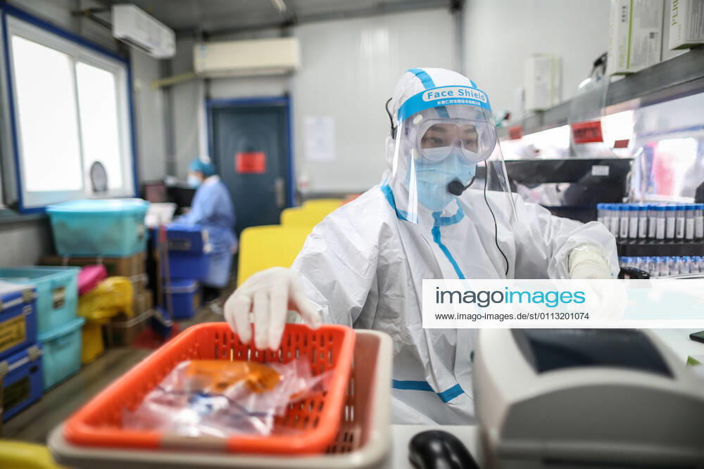 (210216) -- SHENYANG, Feb. 16, 2021 -- Sun Hewen, a medical worker with Shengjing Hospital of China Medical University, collects nucleic acid samples in Shenyang, capital of northeast China s Liaoning Province, Feb. 16, 2021. Since December last year, some areas in China s northeastern Heilongjiang, Jilin, and Liaoning Provinces reported newly confirmed COVID-19 cases. Related areas responded immediately according to epidemic prevention requirements. Mass nucleic acid testing were conducted in key areas in an effort to stem the spread of the coronavirus. Recently, no new confirmed COVID-19 cases have been reported here for several days. During the Spring Festival vacation, many workers stick to their posts to make sure we can celebrate the