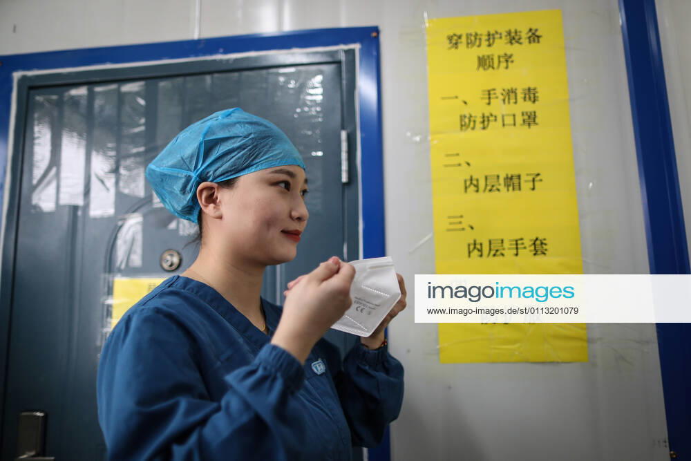 (210216) -- SHENYANG, Feb. 16, 2021 -- Sun Hewen, a medical worker with Shengjing Hospital of China Medical University, puts on a mask in Shenyang, capital of northeast China s Liaoning Province, Feb. 16, 2021. Since December last year, some areas in China s northeastern Heilongjiang, Jilin, and Liaoning Provinces reported newly confirmed COVID-19 cases. Related areas responded immediately according to epidemic prevention requirements. Mass nucleic acid testing were conducted in key areas in an effort to stem the spread of the coronavirus. Recently, no new confirmed COVID-19 cases have been reported here for several days. During the Spring Festival vacation, many workers stick to their posts to make sure we can celebrate the festival safel