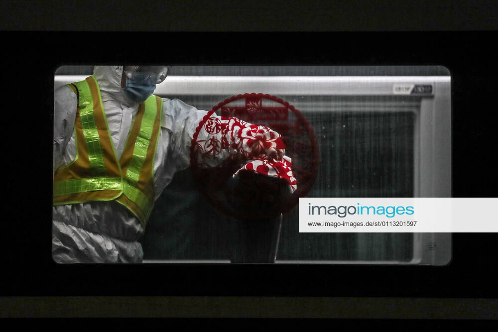 (210216) -- SHENYANG, Feb. 16, 2021 -- Wang Tong, a mechanic of China Railway Shenyang Bureau, disinfects a train in Shenyang, capital of northeast China s Liaoning Province, Feb. 14, 2021. Since December last year, some areas in China s northeastern Heilongjiang, Jilin, and Liaoning Provinces reported newly confirmed COVID-19 cases. Related areas responded immediately according to epidemic prevention requirements. Mass nucleic acid testing were conducted in key areas in an effort to stem the spread of the coronavirus. Recently, no new confirmed COVID-19 cases have been reported here for several days. During the Spring Festival vacation, many workers stick to their posts to make sure people can celebrate the festival safely. ) CHINA-SPRING