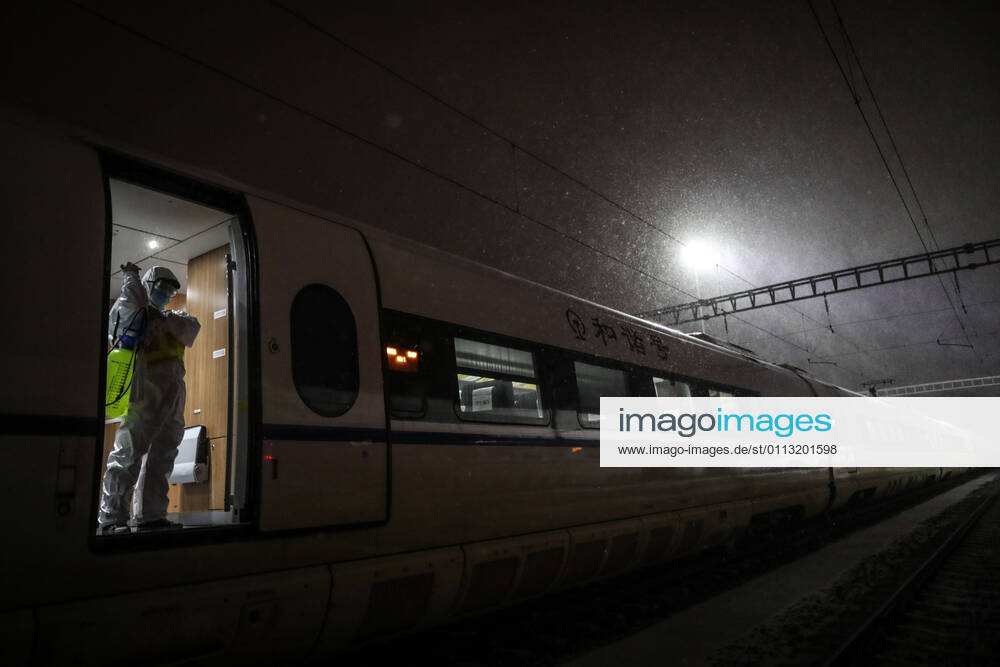 (210216) -- SHENYANG, Feb. 16, 2021 -- Wang Tong, a mechanic of China Railway Shenyang Bureau, puts on protective gears on a train in Shenyang, capital of northeast China s Liaoning Province, Feb. 14, 2021. Since December last year, some areas in China s northeastern Heilongjiang, Jilin, and Liaoning Provinces reported newly confirmed COVID-19 cases. Related areas responded immediately according to epidemic prevention requirements. Mass nucleic acid testing were conducted in key areas in an effort to stem the spread of the coronavirus. Recently, no new confirmed COVID-19 cases have been reported here for several days. During the Spring Festival vacation, many workers stick to their posts to make sure people can celebrate the festival safel