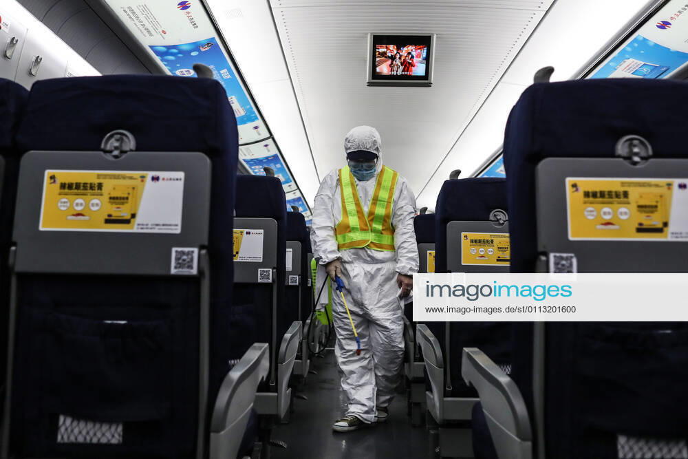 (210216) -- SHENYANG, Feb. 16, 2021 -- Wang Tong, a mechanic of China Railway Shenyang Bureau, disinfects a train in Shenyang, capital of northeast China s Liaoning Province, Feb. 14, 2021. Since December last year, some areas in China s northeastern Heilongjiang, Jilin, and Liaoning Provinces reported newly confirmed COVID-19 cases. Related areas responded immediately according to epidemic prevention requirements. Mass nucleic acid testing were conducted in key areas in an effort to stem the spread of the coronavirus. Recently, no new confirmed COVID-19 cases have been reported here for several days. During the Spring Festival vacation, many workers stick to their posts to make sure people can celebrate the festival safely. ) CHINA-SPRING
