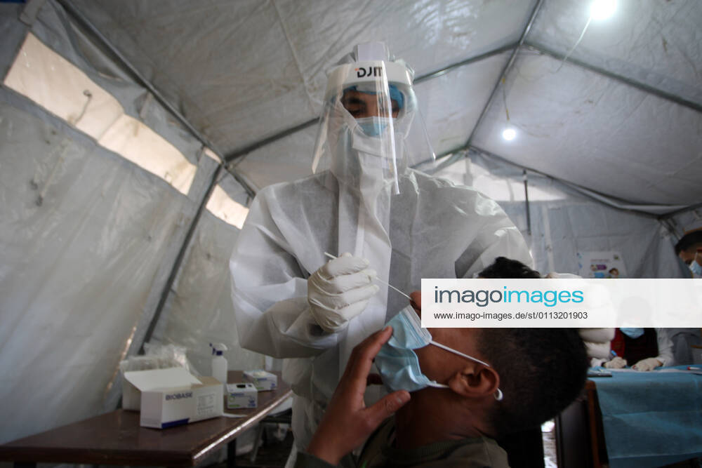 A Palestinian paramedic wearing a full protective suit, administers a COVID-19 test on Tuesday, February 16, 2021 in Khan Yunis, southern Gaza. The Palestinian Authority claims that Israel is stopping delivery of COVID-19 vaccines into Gaza, from the West Bank. GAZ2021021606 IsmaelxMohamad