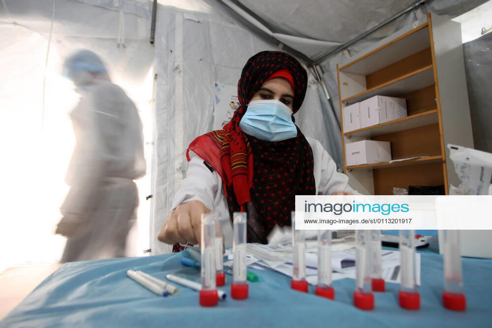 A Palestinian paramedic wearing a full protective suit, organizes COVID-19 tests on Tuesday, February 16, 2021 in Khan Yunis, southern Gaza. The Palestinian Authority claims that Israel is stopping delivery of COVID-19 vaccines into Gaza, from the West Bank. GAZ2021021614 IsmaelxMohamad