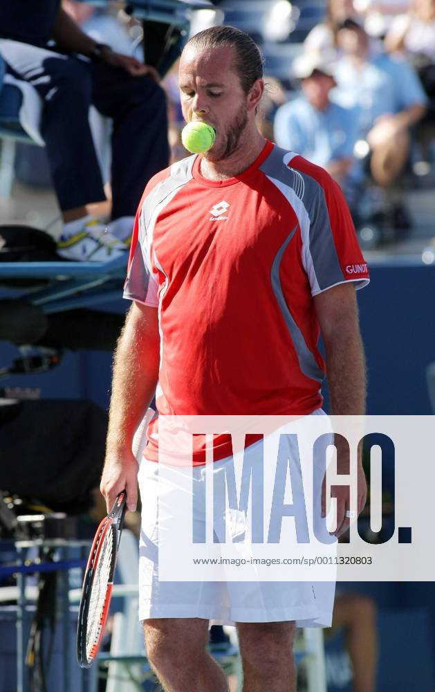 Xavier Malisse of Belgium bits the tennis ball after losing a tiebreaker point in the fourth set during first-round action at the 2012 U.S. Open held at the National Tennis Center on August 29, 2012 in New York. UPI Photo Monika Graff NYP20120829329