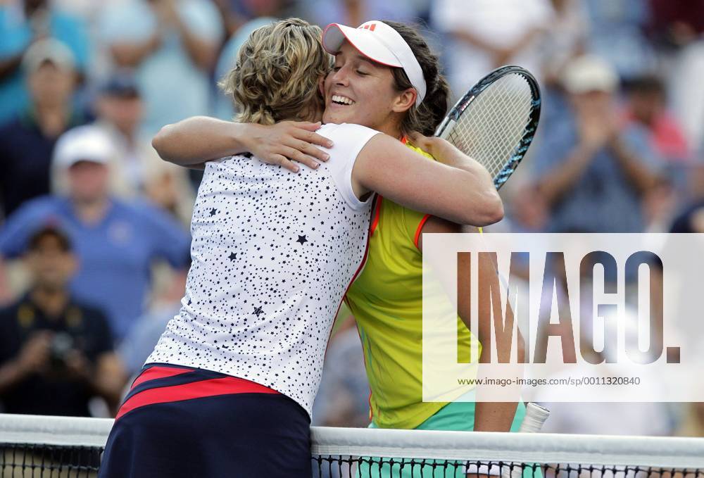 Kim Clijsters of Belgium hugs Laura Robson of Great Britain after her second round defeat at the 2012 U.S. Open Tennis Championships in Arthur Ashe Stadium at the Billie Jean King National Tennis Center in New York City on August 29, 2012. NYP20120829120