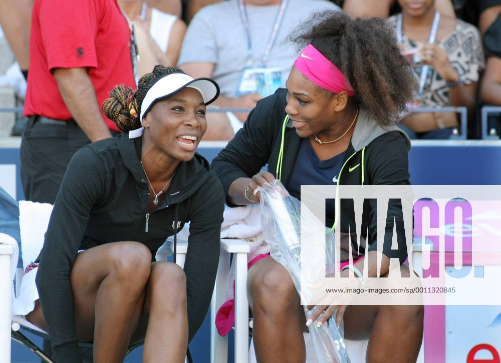 Venus Williams (L) and her sister Serena, USA, chat before the start of their women s double match at the 2012 U.S. Open held at the National Tennis Center on August 29, 2012 in New York. UPI Photo Monika Graff NYP20120829333
