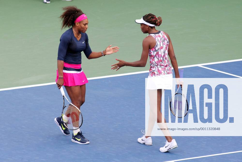 Serena Williams (L) and her sister Venus, USA, congratulate each other during the first-round women s double match at the 2012 U.S. Open held at the National Tennis Center on August 29, 2012 in New York. UPI Photo Monika Graff NYP20120829339