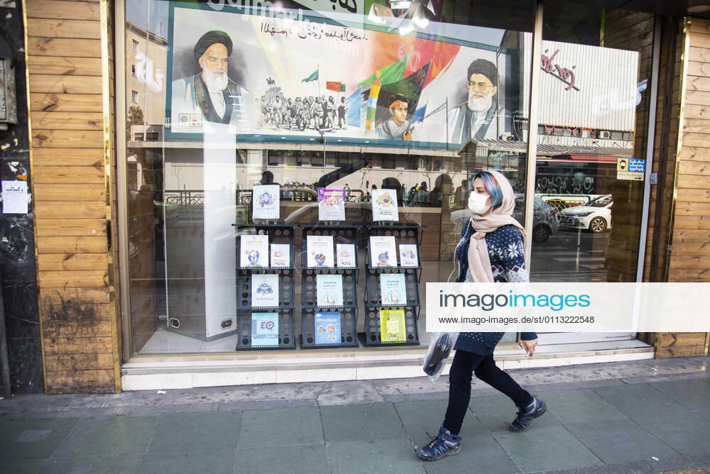 Iran: Warning for the fourth wave of the coronavirus outbreak Portraits of supreme leader of Iran, Ayatollah Ali Khamenei and the Iran s late leader Ayatollah Khomeini are reflected in a bookstore window in Enghelab(Revolution) street, Tehran, Iran. Since the beginning of February 2021, the number of people infected with the Coronavirus has been increasing in Iran. Tehran Tehran Iran