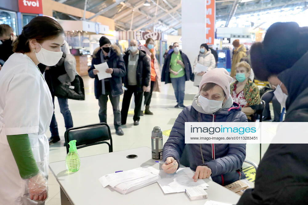 Processing documents outside a mobile COVID-19 vaccination unit set up at the Dirizhabl Airship shopping centre, injections of the Gam-COVID-Vac (Sputnik-V) free of charge, no prior appointment required. Donat Sorokin TASS TS0F7017