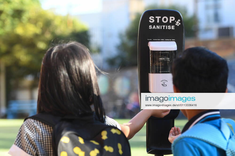 VICTORIA CORONAVIRUS COVID19, Students use a hand sanitiser station as they arrive to Carlton Gardens Primary school in Melbourne, Thursday, February 18, 2021. Victoria has recorded no new locally acquired coronavirus cases as life returns to COVID-normal after the state s five-day circuit breaker lockdown. ( NO ARCHIVING, , NO USE IN BOOKS WITHOUT CONSENT MELBOURNE VIC AUSTRALIA
