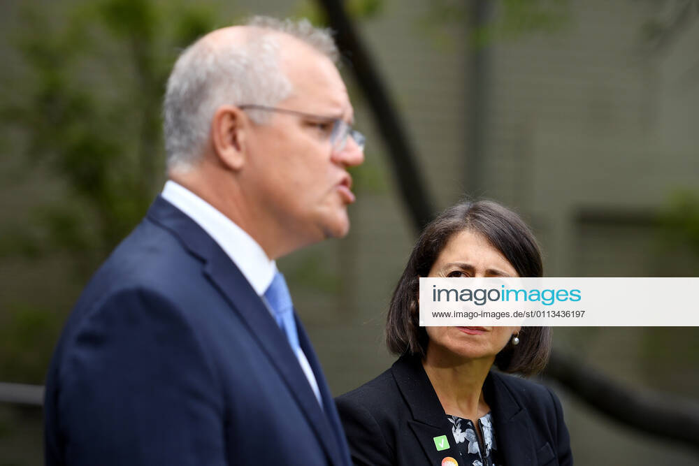 SCOTT MORRISON VACCINE HOSPITAL TOUR, NSW Premier Gladys Berejiklian looks on as Prime Minister Scott Morrison addresses media following a tour of a COVID-19 vaccination hub at Royal Prince Alfred hospital in Sydney, Friday, February 19, 2021. The first COVID-19 vaccinations in NSW will take place on Monday, with the Pfizer jab to go out to frontline workers. ( NO ARCHIVING, , NO USE IN BOOKS WITHOUT CONSENT Sydney NSW AUSTRALIA