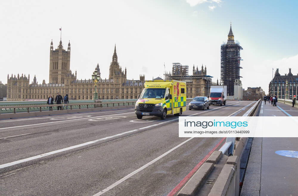 An ambulance drives past the Houses of Parliament on Westminster Bridge in London..Coronavirus cases are falling across the UK, as the government prepares to present its plan for easing the lockdown restrictions. London United Kingdom - ZUMAs197 20210218_zaa_s197_200
