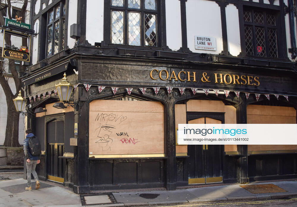A man walks past the closed Coach & Horses pub in Central London..Coronavirus cases are falling across the UK, as the government prepares to present its plan for easing the lockdown restrictions. London United Kingdom - ZUMAs197 20210218_zaa_s197_202