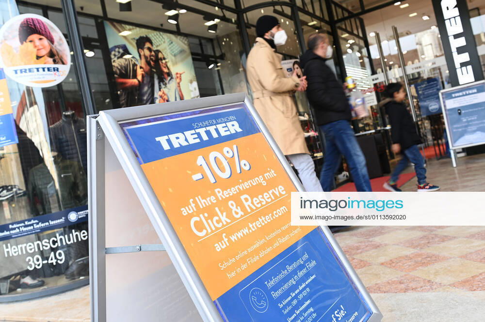 Theme picture Click and Collect in a shoe store in Munich on 19 02 2021 Display in front of a store with the notice to pick up online ordered goods in the store Click and Reserve with 10 percent discount,