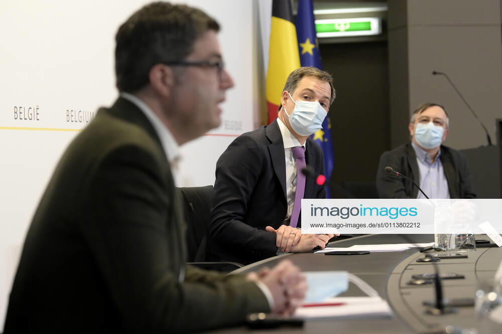 Sciensano s Steven Van Gucht , Prime Minister Alexander De Croo and Sciensano s Yves Van Laethem pictured during a press conference of the Federal Government regarding the Covid-19 infection statistics, Monday 22 February 2021 in Brussels. POOLxPHILIPxREYNAERS 2649751
