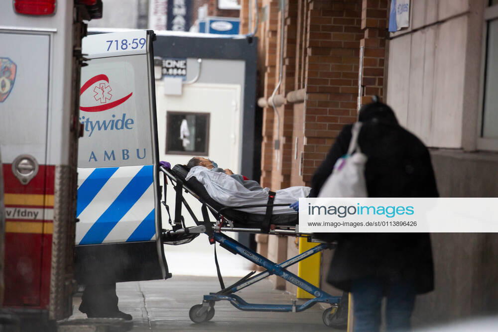 (210223) -- NEW YORK, Feb. 23, 2021 -- Medical workers wheel a patient in front of Maimonides Medical Center in the Brooklyn Borough of New York, the United States, Feb. 22, 2021. The United States reached the grim milestone of half a million coronavirus deaths on Monday, according to the Center for Systems Science and Engineering (CSSE) at Johns Hopkins University. (Photo by Xinhua) U.S.-NEW YORK-COVID-19-DEATH-HALF A MILLION MichaelxNagle