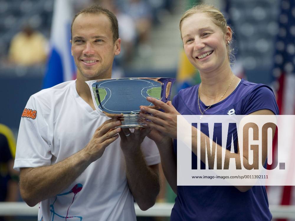 Ekaterina Makarova of Russia, and Bruno Soares of Brazil celebrate to become the 2012 US Open Mixed Doubles Champions. during the US Open tennis tournament at the BillieJeanKing National Tennis Center in Flushing, NY. TENNIS: SEP 06 US Open Icon20143368