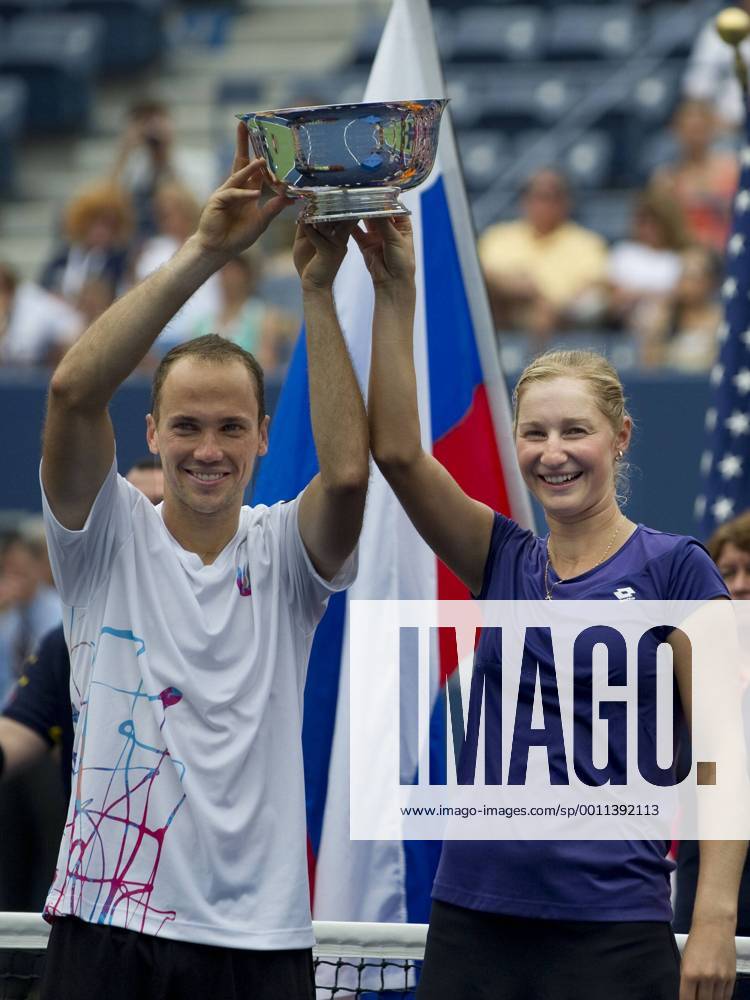 Ekaterina Makarova of Russia, and Bruno Soares of Brazil pose with trophies to become the 2012 US Open Mixed Doubles Champions. during the US Open tennis tournament at the BillieJeanKing National Tennis Center in Flushing, NY. TENNIS: SEP 06 US Open Icon20143367