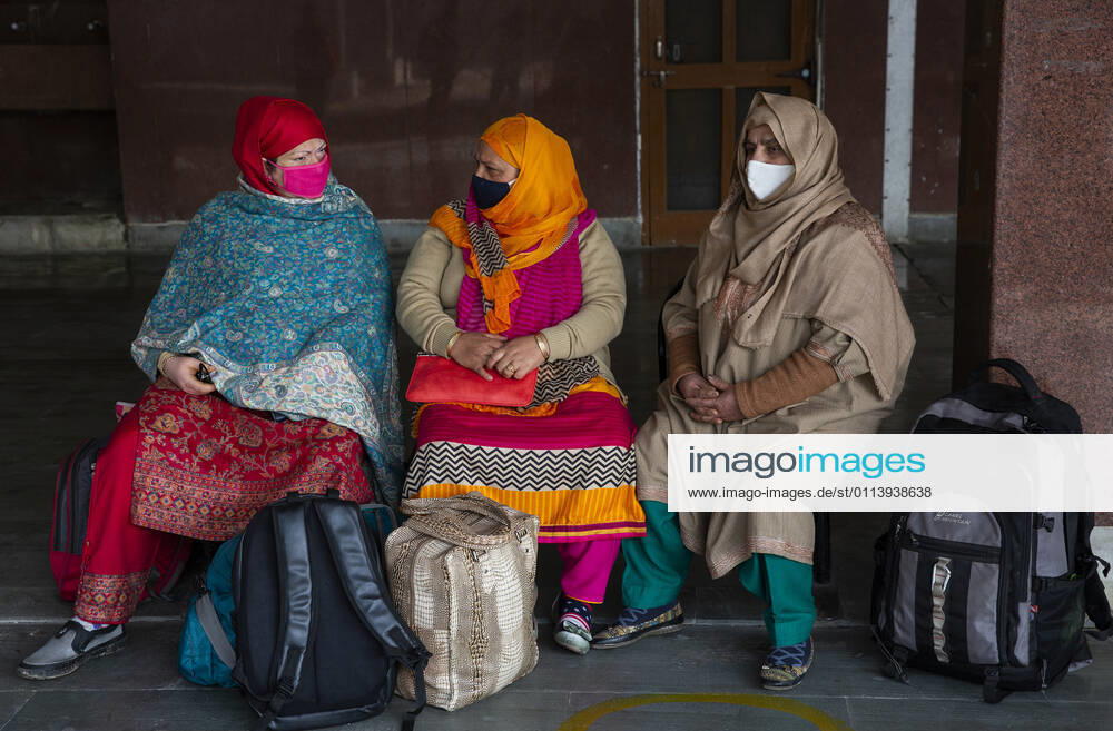 (210223) -- SRINAGAR, Feb. 23, 2021 -- Passengers wearing face masks wait for a train at a train station in Srinagar city, the summer capital of Indian-controlled Kashmir, Feb. 23, 2021. Train service was resumed partially in Indian-controlled Kashmir after a gap of 11 months, officials said Tuesday. The service was suspended on March 19 last year owing to the outbreak of the COVID-19 pandemic. ) KASHMIR-TRAIN SERVICE-RESUMPTION JavedxDar