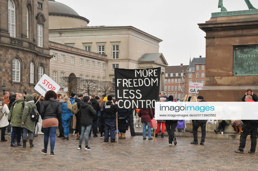 Copenhagen, Denmark. 23 February 2021, Danes proetesting againest coronavirus pandemic new debate in danish parliamenet about quick corona virus pandemic law in danish parliament with all political parties and stage anti pandemic law debates in front of danish parliament and danish police stand peaceful proteact danish parliament in front christiansborg danish parliament in Copenhagen. (Photo..Francis Dean Deanpictures)