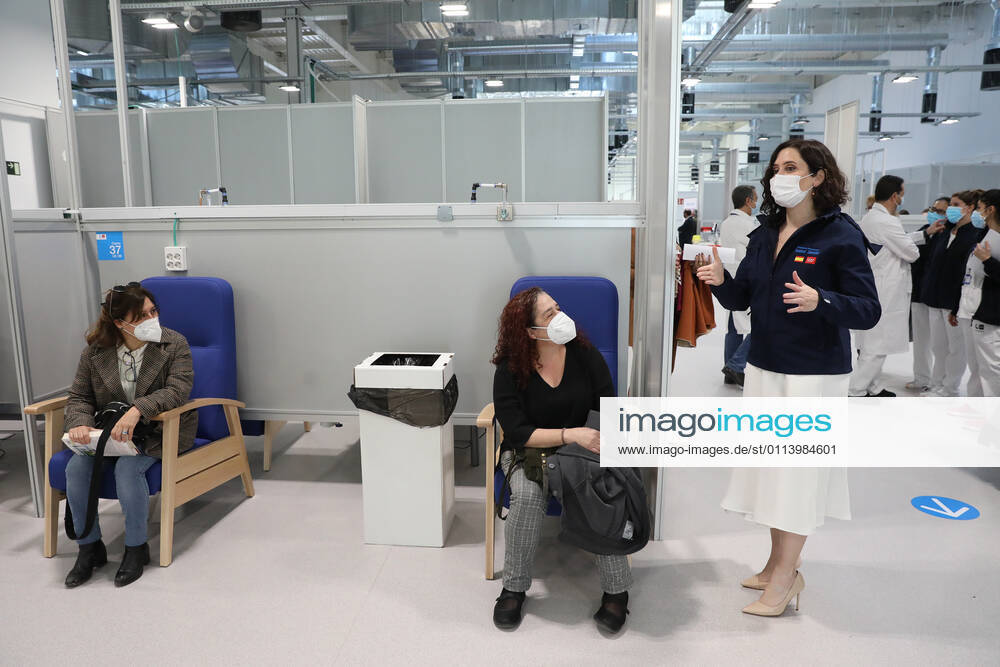 The President of the Community of Madrid, Isabel Diaz Ayuso (r), talks with two patients during her visit to the start of the vaccination process against COVID-19 that has been launched in Pavilion 3 of the Public Hospital Enfermera Isabel Zendal, in Madrid, (Spain), on February 23, 2021. This Tuesday begins the vaccination in the pavilion 3 of the hospital with the vaccine of AstraZeneca to 400 people of External Health, AENA, inspectors of Public Health, of Institute of Social Security, professionals of reformatories, Forensic Doctors, Students of CC Health and veterinarians. These new groups to be vaccinated will be joined by those over 80 years of age on Thursday 25 February in the Primary Care centres of each of the health areas of th