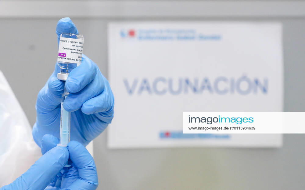 A health professional holds a vial with the vaccine against COVID-19 from AstraZeneca, in the Pavilion 3 of the Public Hospital Enfermera Isabel Zendal, in Madrid, (Spain), on February 23, 2021. This Tuesday begins the vaccination in the pavilion 3 of the hospital with the vaccine of AstraZeneca to 400 people of External Health, AENA, inspectors of Public Health, of Institute of Social Security, professionals of reformatories, Forensic Doctors, Students of CC Health and veterinarians. These new groups to be vaccinated will be joined by those over 80 years of age on Thursday 25 February in the Primary Care centres of each of the health areas of the community with 50,000 doses. 23 FEBRUARY 2021;ISABEL DÃAZ AYUSO;AYUSO;MADRID;COMMUNITY OF MAD