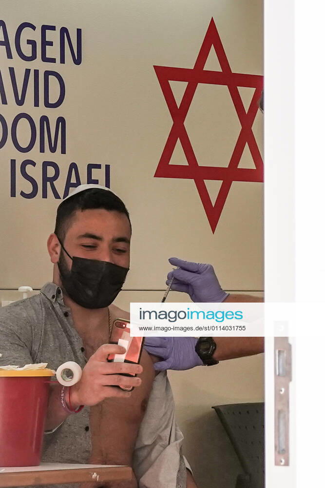 The IDF Home Front Command in coordination with Magen David Adom, serving as the Israeli Red Cross organization and leading EMS, make COVID-19 vaccinating more accessible to those still in denial or refusal operating a mobile vaccination station out of a caravan at Jerusalemâ€⠢s Shuk Mahane Yehuda Market. Jerusalem Israel - ZUMAa126 20210224_zap_a126_020