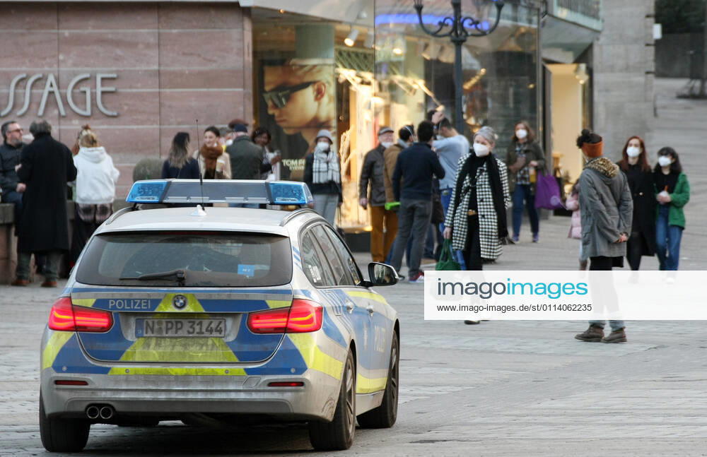 Polizei make a Kontrolle about the Mask use during the Hard Lockdown of the Covid 19 Coronavirus Pandemie in Nurnberg , Bayern , Deutschland . February 24, 2021.