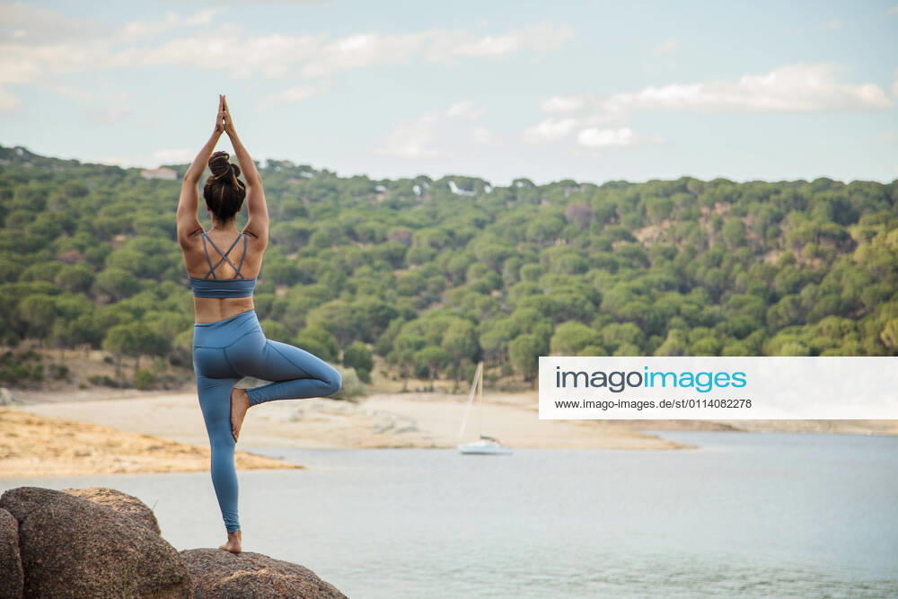 Young woman practicing tree pose model released Symbolfoto MRRF00790