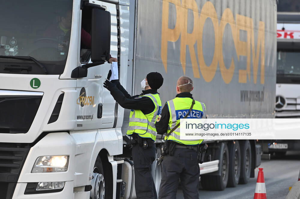 Border controls at the Austrian-German border ,border crossing Kiefersfelden border police officers control trucks, goods carriers, supply chain at the entry from Tyrol Austria to Bavaria Germany
