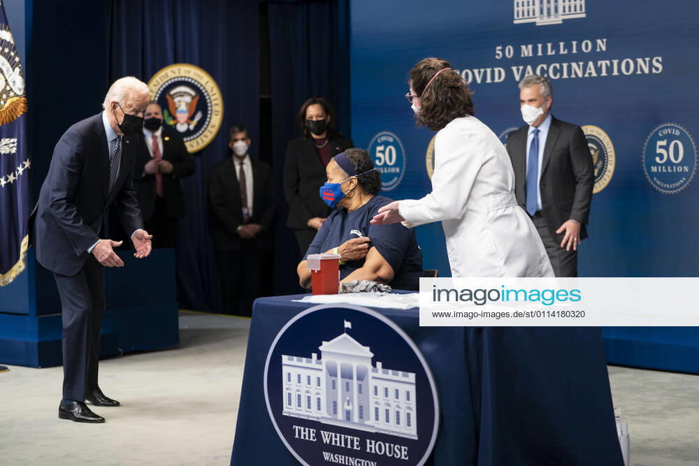 Before getting her Covid Vaccine, President Joe Biden talks with Linda Bussey, who has worked at Safeway for 37 years and currently serves a general merchandise manager in Bethesda, MD. Ms. Bussey lives in Southeast DC. Ms. Bussey has been working ever since the pandemic. as he participates in an event commemorating the 50 million COVID-19 vaccine shot during a ceremony at the White House, Thursday, Feb. 25, 2021. Ms. Bussey lives in Southeast DC. Ms. Bussey has been working ever since the pandemic Washington USA - ZUMAs152 20210225_zaa_s152_214