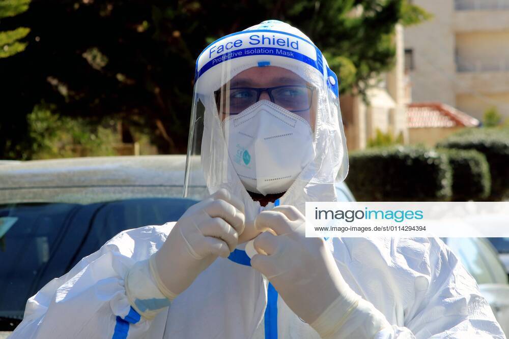 (210227) -- AMMAN, Feb. 27, 2021 -- A health worker prepares to collect samples for COVID-19 tests in Amman, Jordan, Feb. 26, 2021. Jordan on Wednesday decided to reinstate curfew on each Friday starting from Feb. 26 in addition to extending daily curfew by two hours as part of anti-pandemic measures as infections keep rising in the kingdom. During a press conference on Wednesday, Minister of State for Media Affairs Ali Al Ayed announced that businesses are allowed to operate until 9 p.m. local time while public movement will be permitted from 6 a.m. until 10 p.m. as of Thursday. (Photo by Xinhua) JORDAN-AMMAN-COVID-19-CURFEW MohammadxAbuxGhosh